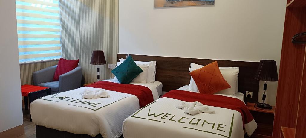 Postel nebo postele na pokoji v ubytování Manta Sky Inn