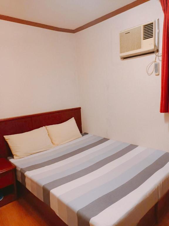 Postel nebo postele na pokoji v ubytování Momiji Hot Spring Hotel