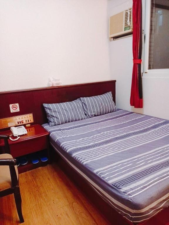 Postel nebo postele na pokoji v ubytování Momiji Hot Spring Hotel
