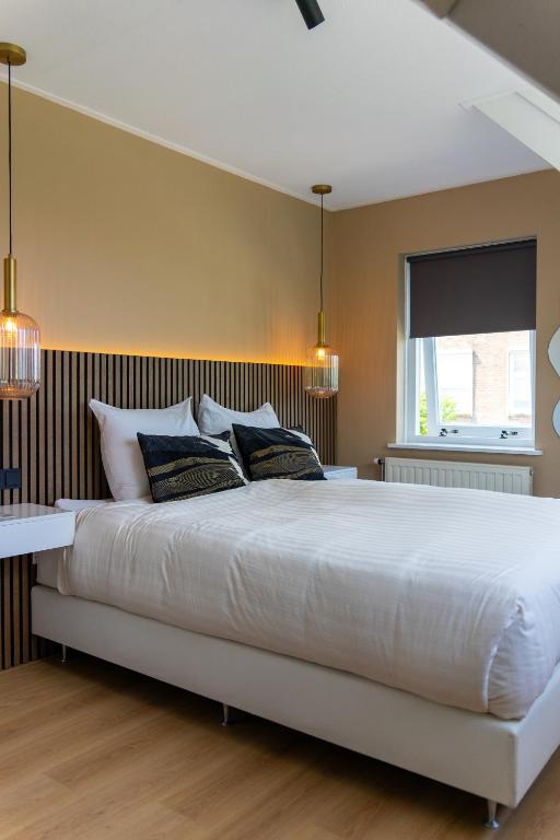 Postel nebo postele na pokoji v ubytování B&B Dijkhuis
