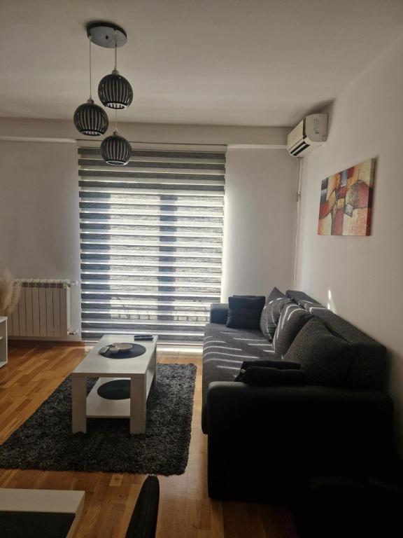 Posezení v ubytování Apartman Tri S
