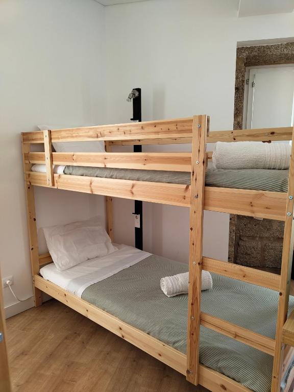 Postel nebo postele na pokoji v ubytování Urbe Sanchina - Hostel & Suites
