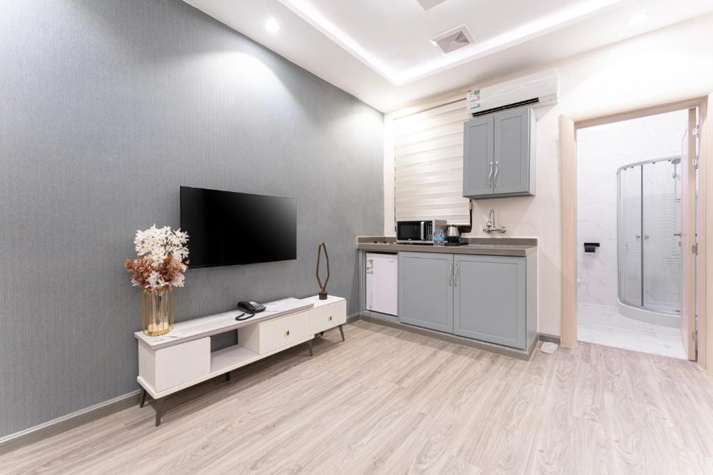 Kuchyň nebo kuchyňský kout v ubytování الكراني للشقق الفندقية - AlKrrani Serviced Apartments