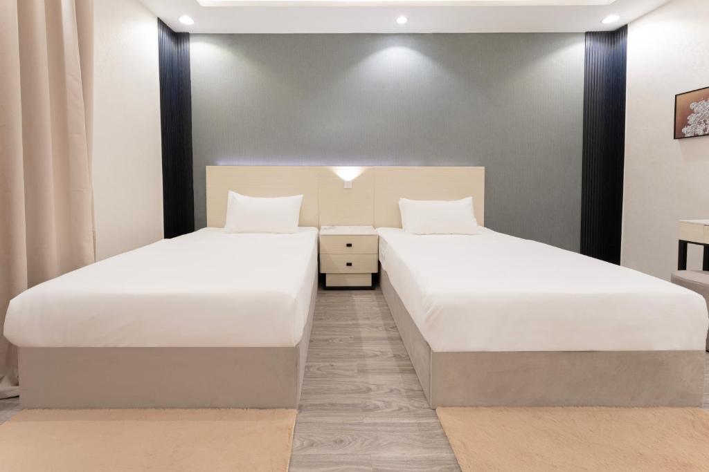 Postel nebo postele na pokoji v ubytování الكراني للشقق الفندقية - AlKrrani Serviced Apartments