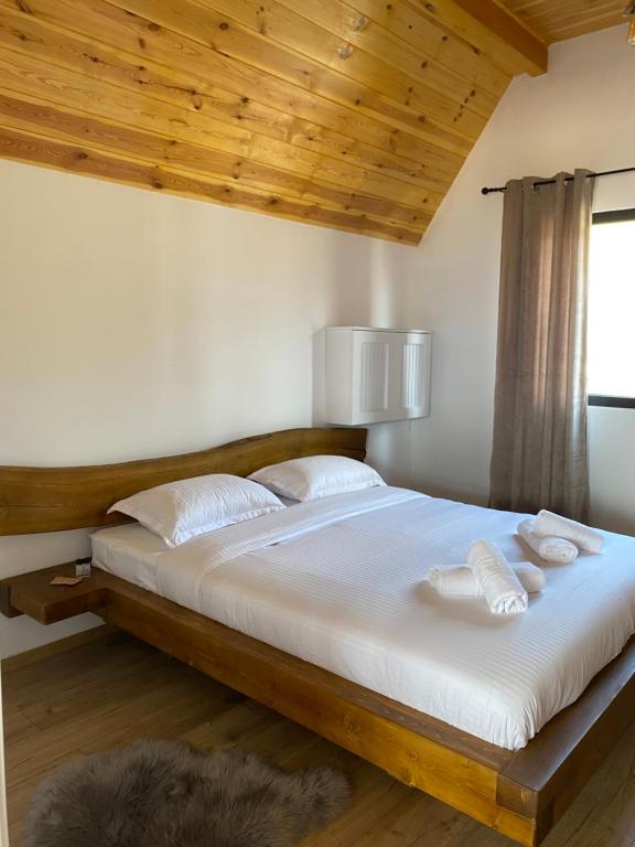 Postel nebo postele na pokoji v ubytování A-Frame Belvedere Colibița