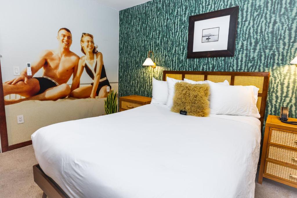 Postel nebo postele na pokoji v ubytování Daddy O Hotel