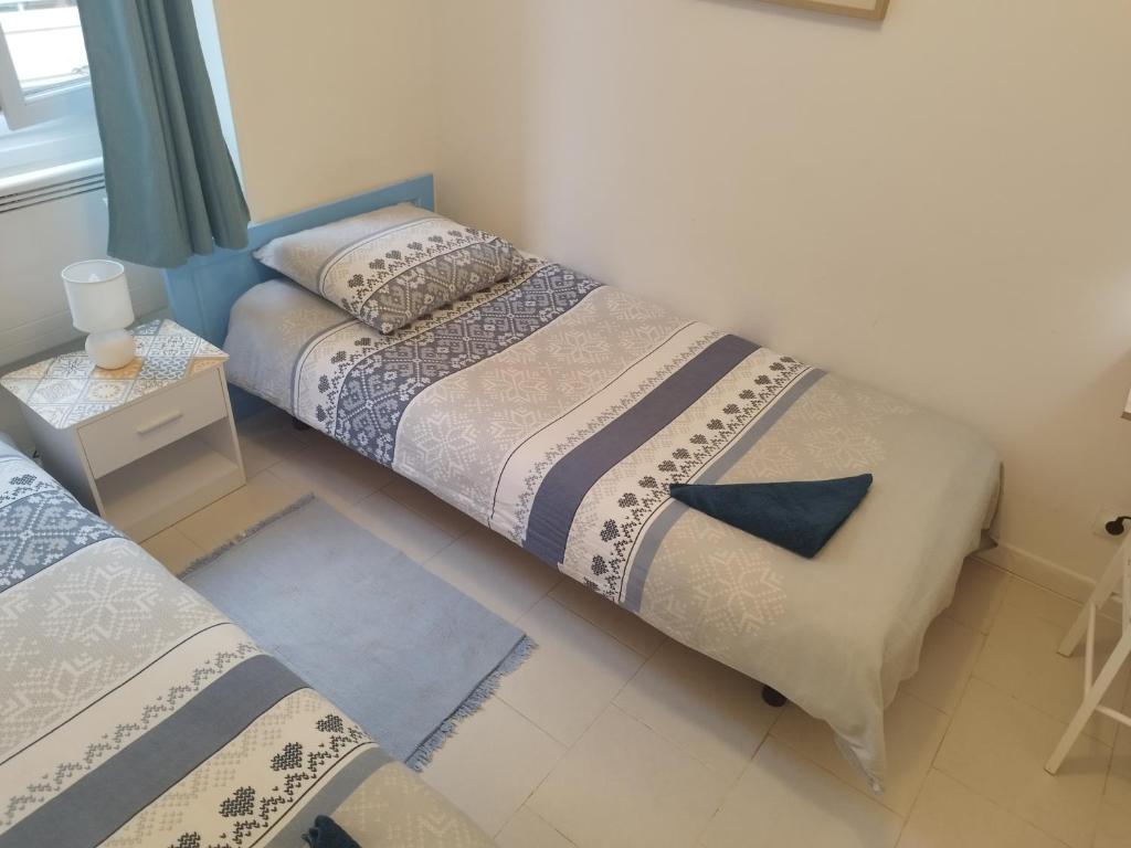 Postel nebo postele na pokoji v ubytování Private Room in Shared Apartment in the Center of Nice