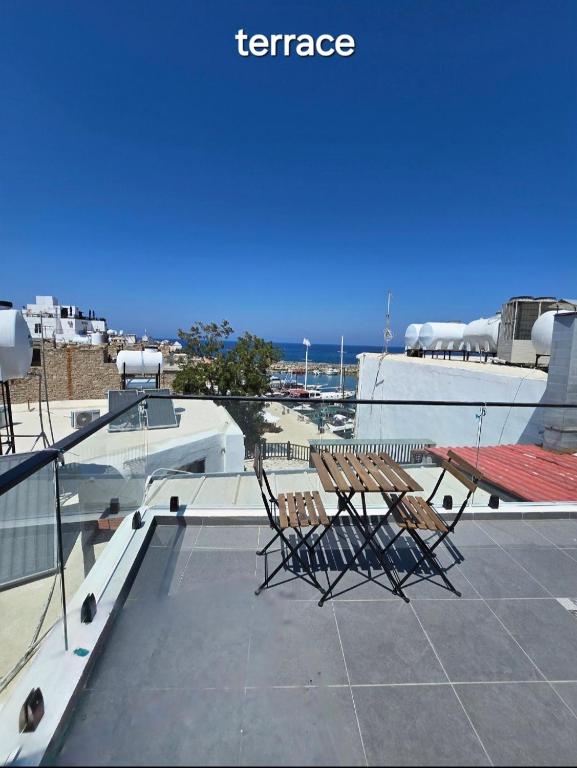 two chairs sitting on top of a roof at Cyprus Harbour Suites in Kyrenia