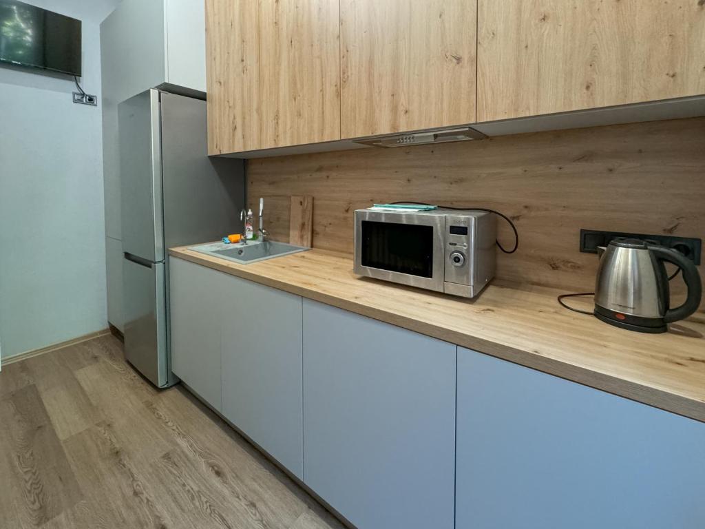 Kuchyň nebo kuchyňský kout v ubytování Apartments White Pearl Sadova