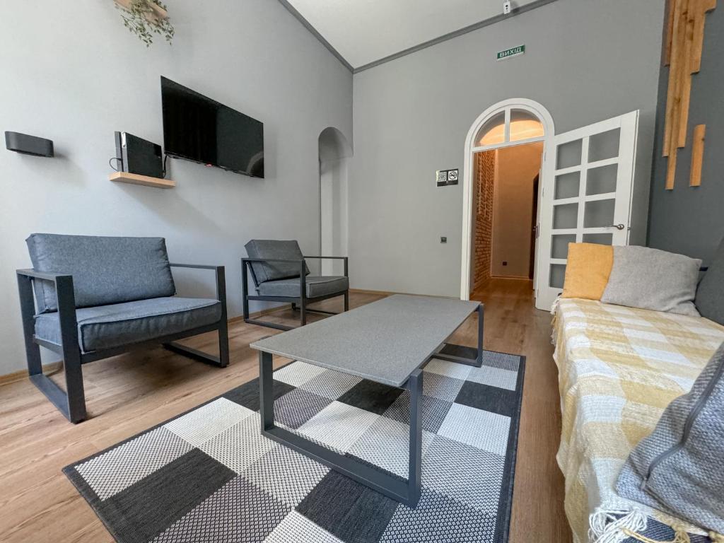 TV a/nebo společenská místnost v ubytování Apartments White Pearl Sadova