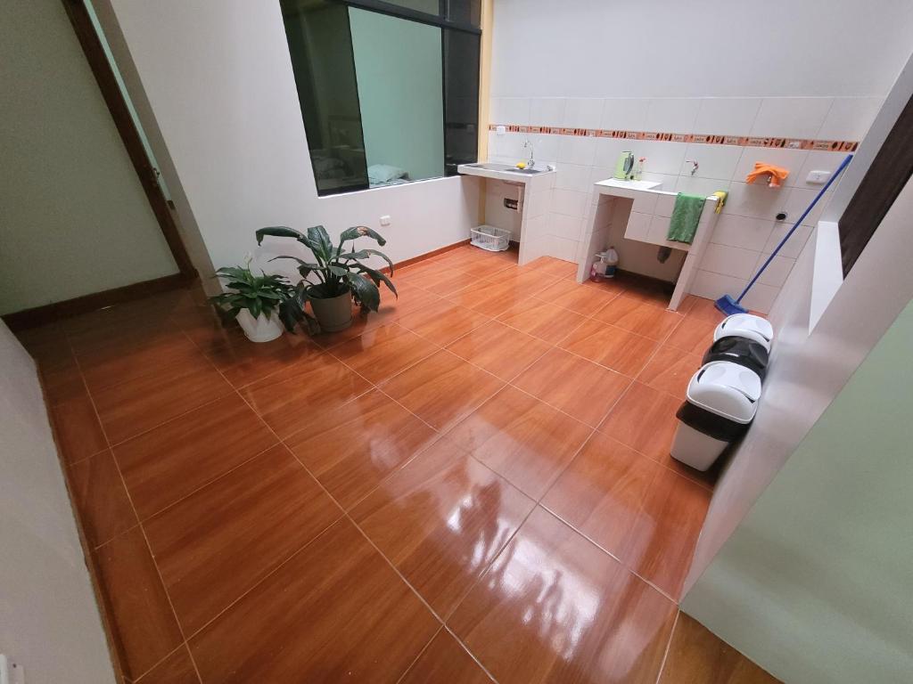 an aerial view of a bathroom with a wooden floor at 3era Habitación Privada a 1 cuadra de la plaza de armas in Oxapampa