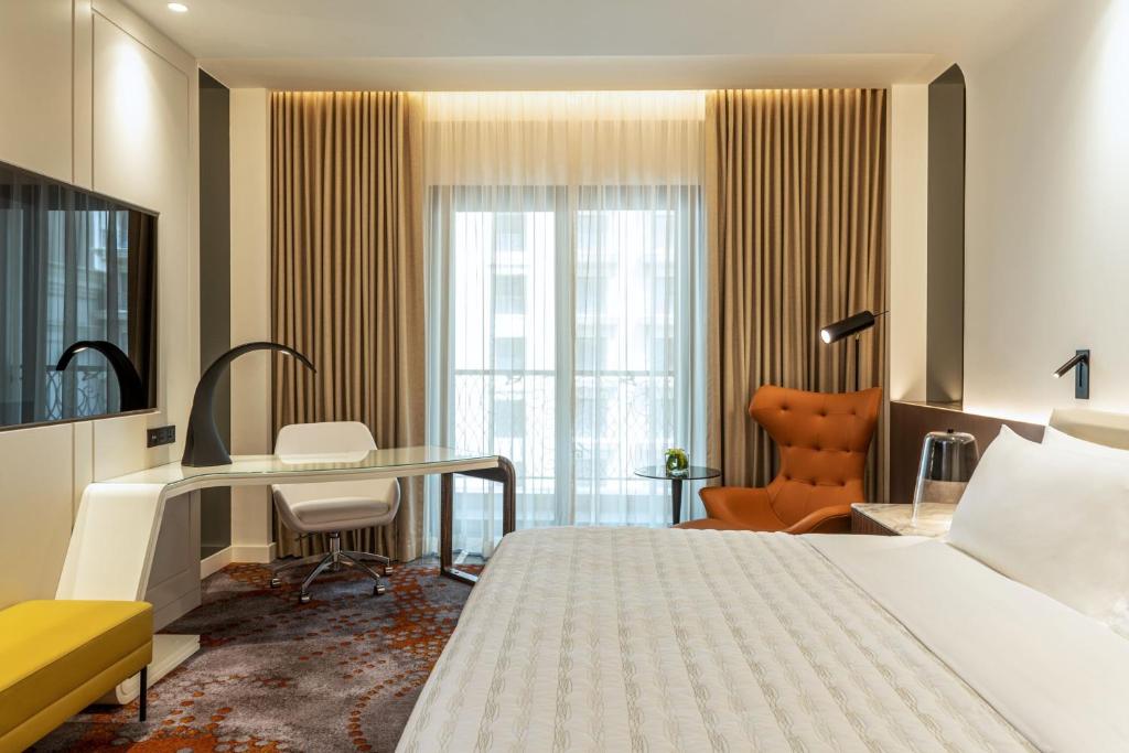 Le Royal Méridien Place Vendôme Lusailにあるベッド