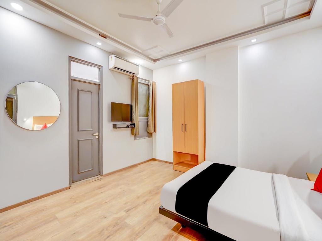 Postel nebo postele na pokoji v ubytování Super Capital O Jp Tower