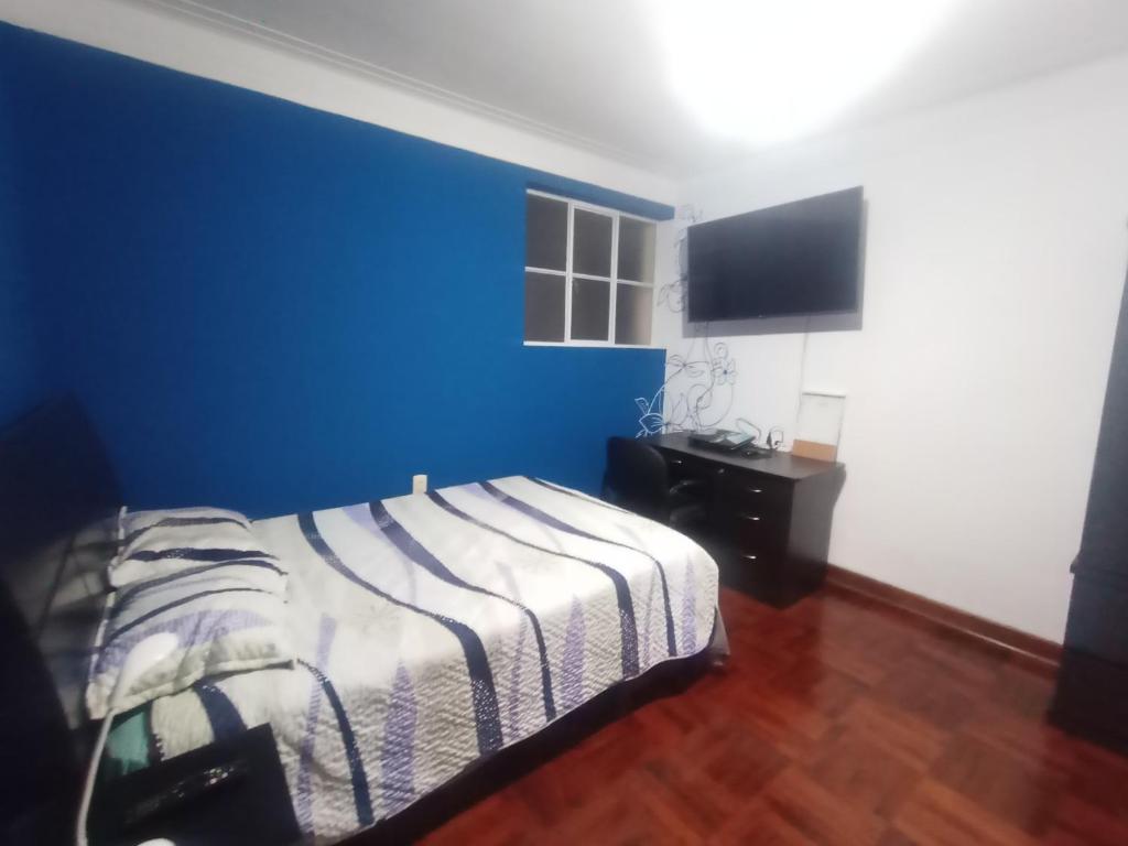 Postel nebo postele na pokoji v ubytování Eli Travelers House