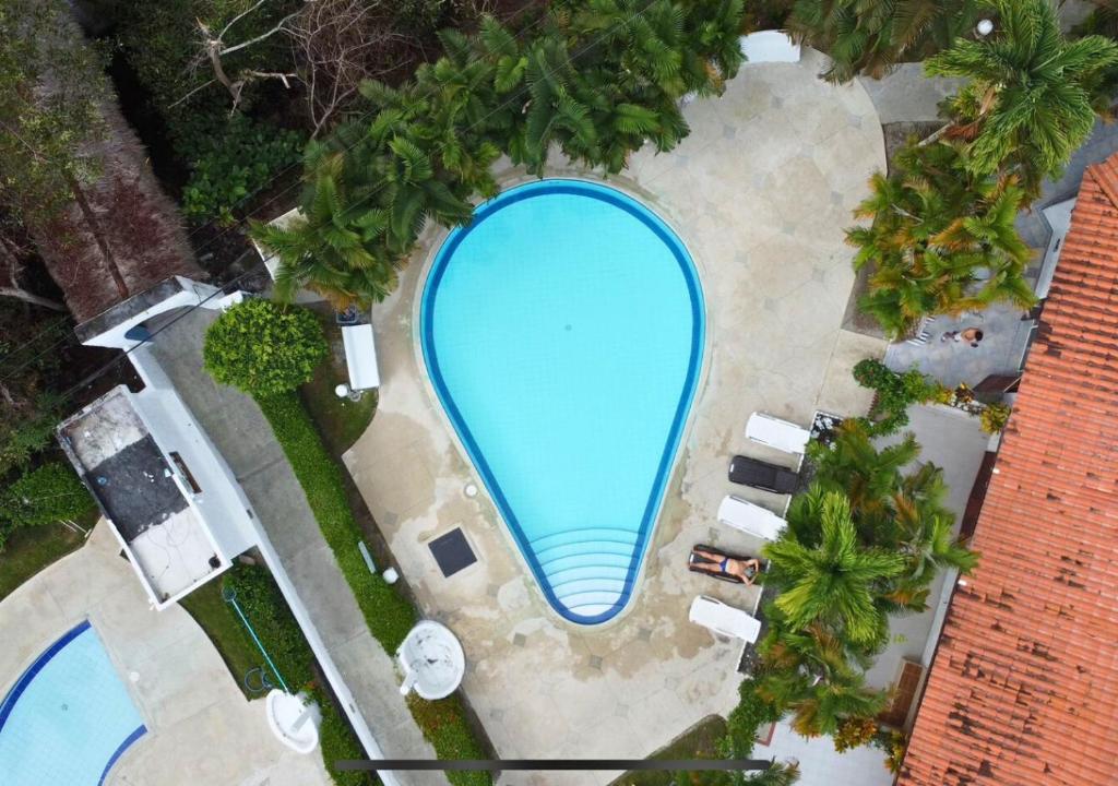 Bazén v ubytování Hermosa casa frente a la playa nebo v jeho okolí