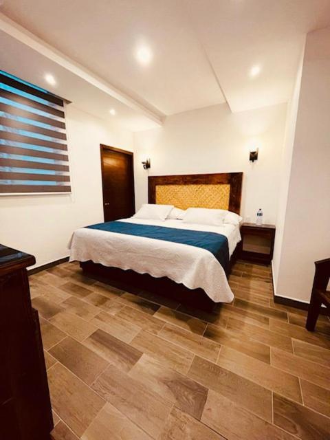Postel nebo postele na pokoji v ubytování Gran Hotel Yacatas