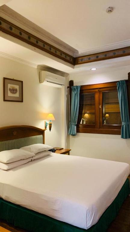 Voodi või voodid majutusasutuse Kresna Hotel toas
