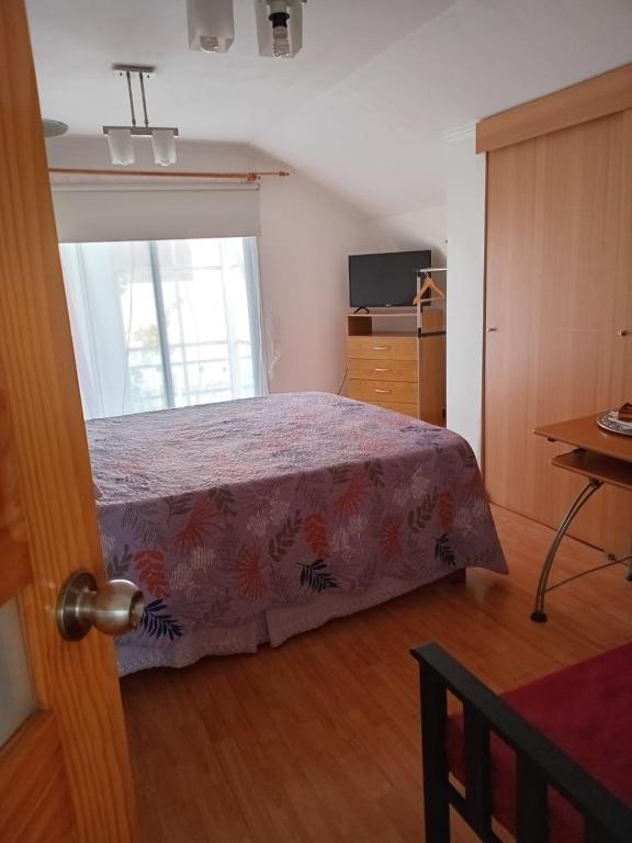 Ένα ή περισσότερα κρεβάτια σε δωμάτιο στο Bienvenidos a mí casa
