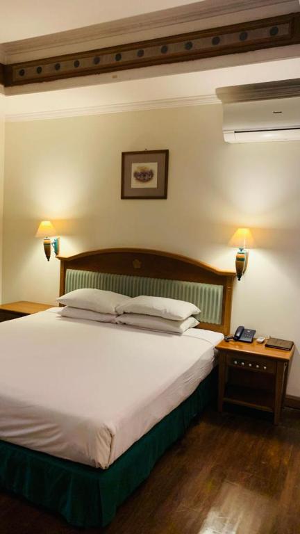 Voodi või voodid majutusasutuse Kresna Hotel toas