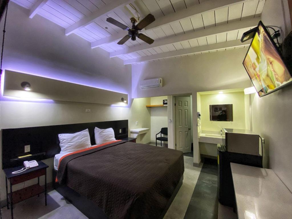 Postel nebo postele na pokoji v ubytování Motel Reno