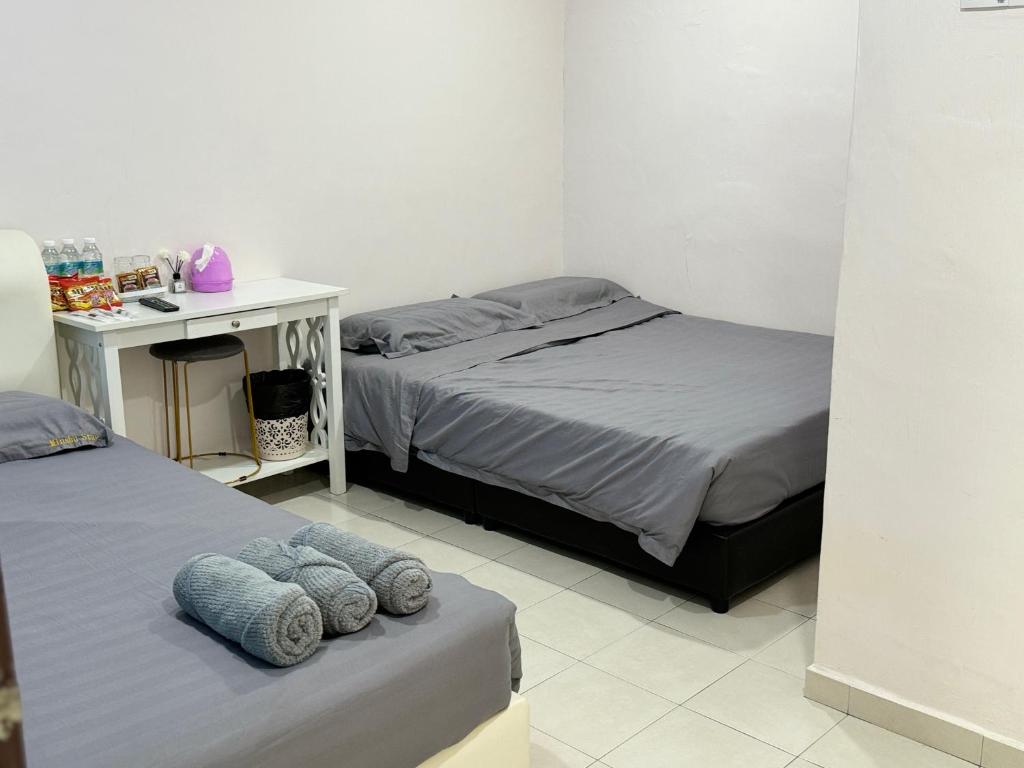 Postel nebo postele na pokoji v ubytování Minshu RoomStay