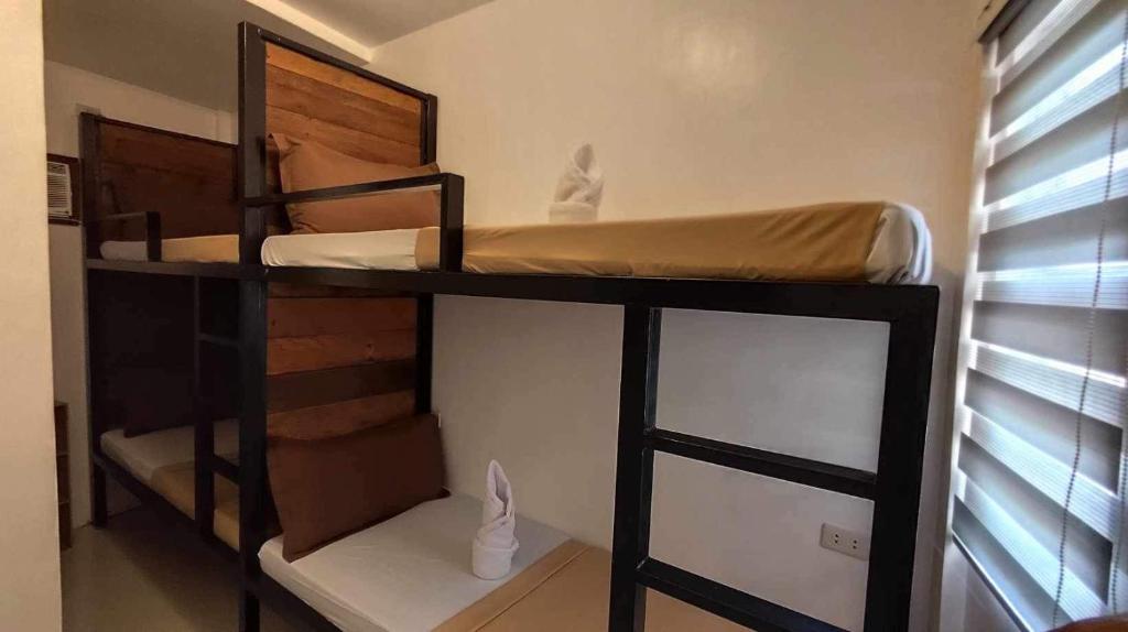Postel nebo postele na pokoji v ubytování Prim Travellers Inn