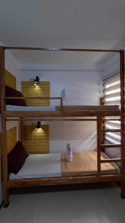 Postel nebo postele na pokoji v ubytování Prim Travellers Inn