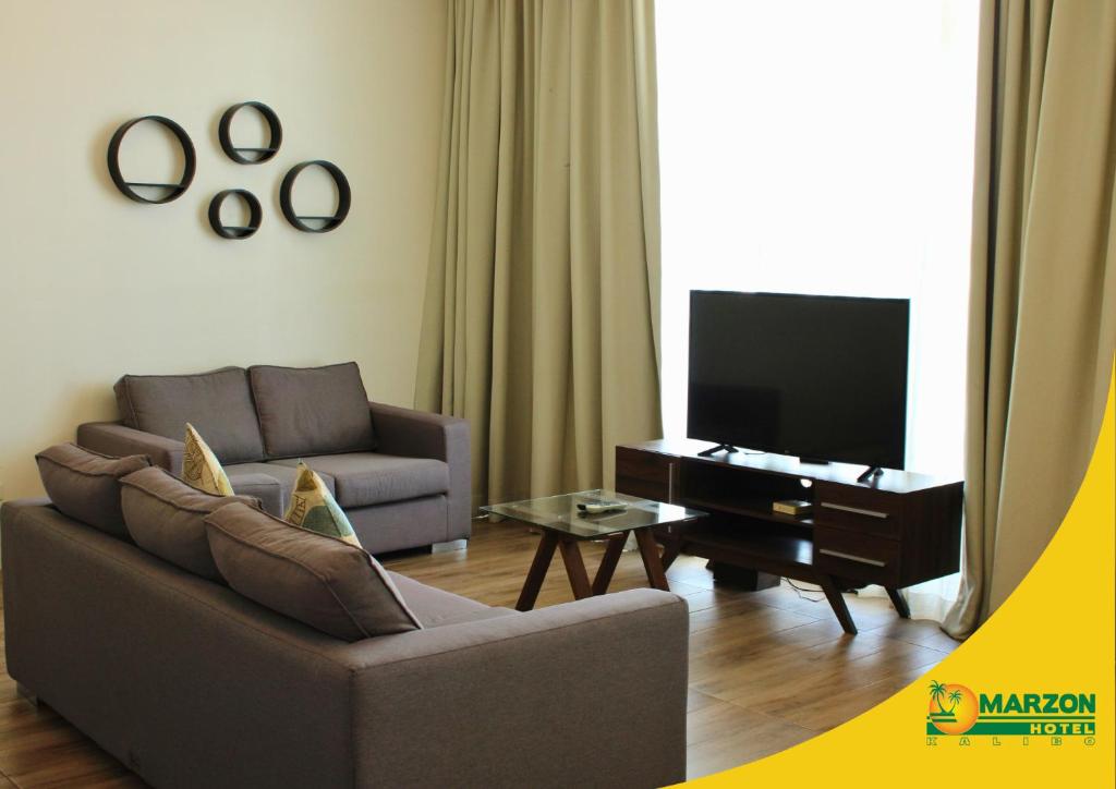 TV a/nebo společenská místnost v ubytování MARZON HOTEL KALIBO