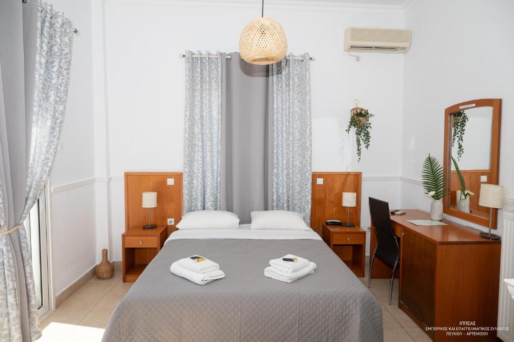 Postel nebo postele na pokoji v ubytování Galini Hotel