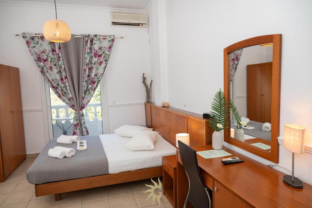 Postel nebo postele na pokoji v ubytování Galini Hotel