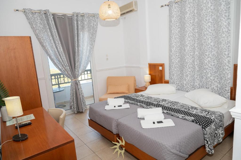 Postel nebo postele na pokoji v ubytování Galini Hotel