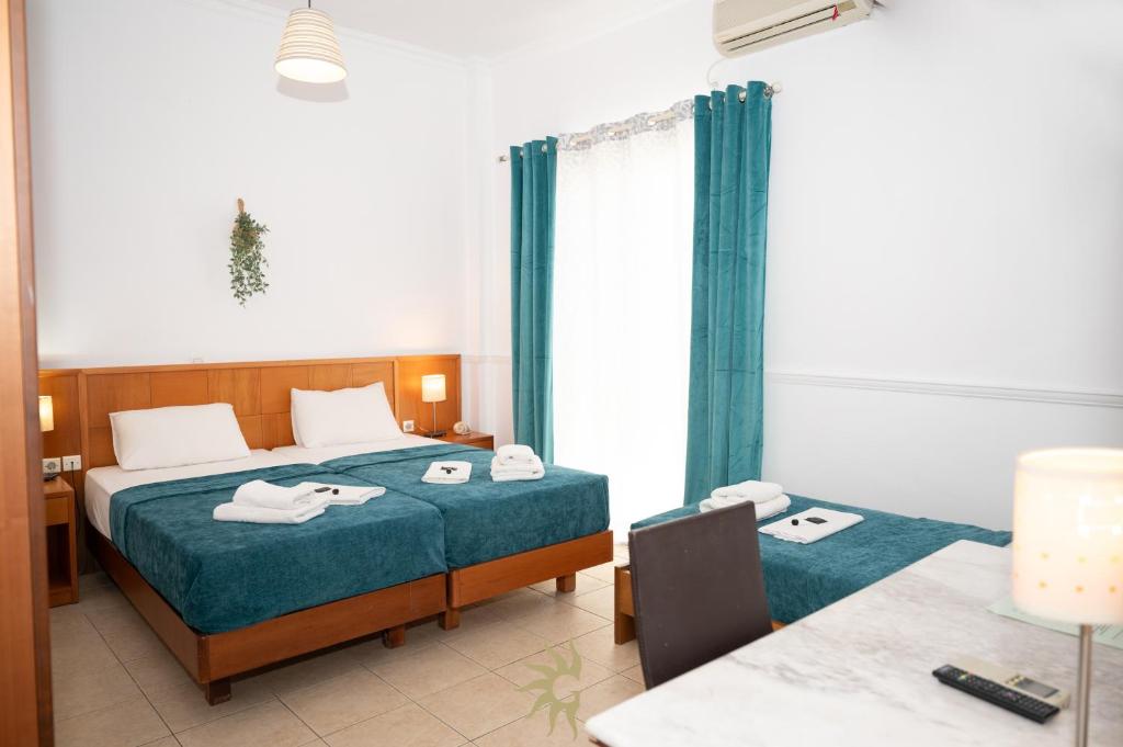 Postel nebo postele na pokoji v ubytování Galini Hotel