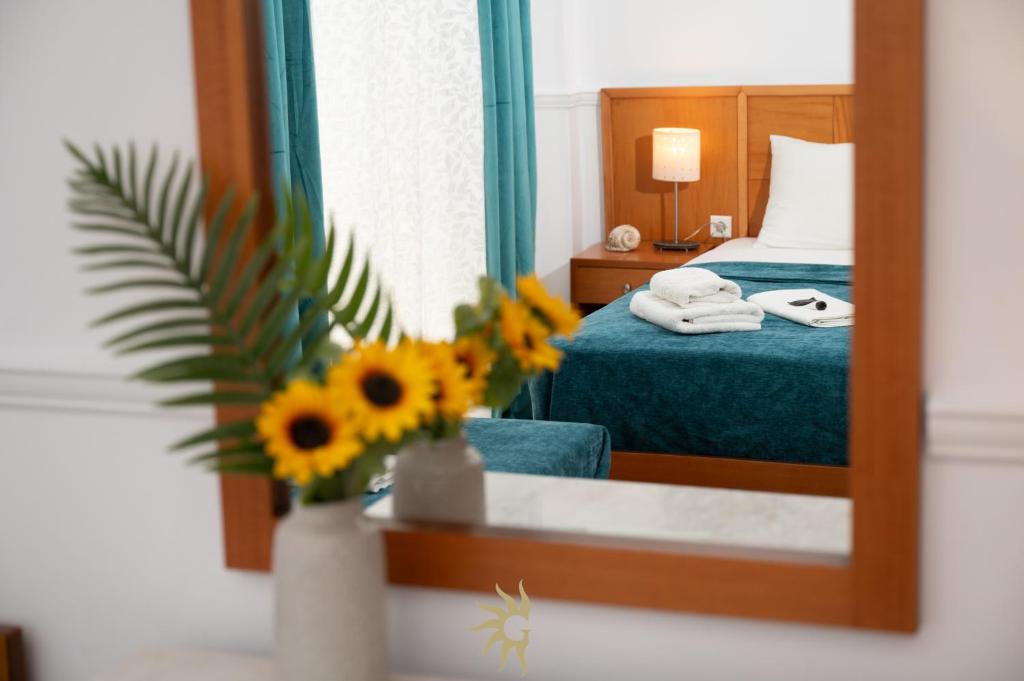 Postel nebo postele na pokoji v ubytování Galini Hotel