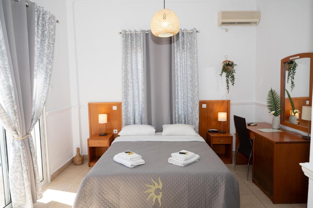 Postel nebo postele na pokoji v ubytování Galini Hotel