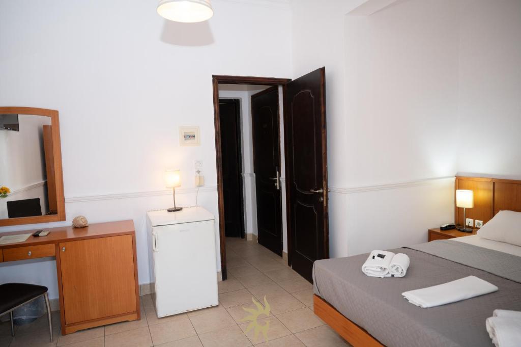 Postel nebo postele na pokoji v ubytování Galini Hotel