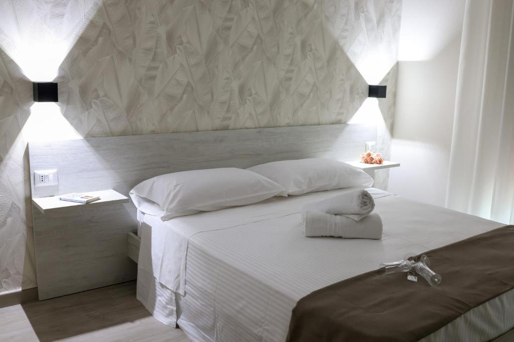 Postel nebo postele na pokoji v ubytování Bed and Breakfast 3 Medaglie