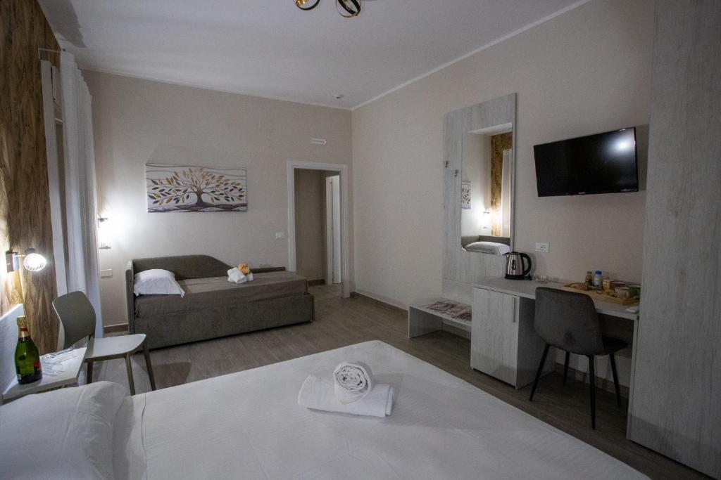 Postel nebo postele na pokoji v ubytování Bed and Breakfast 3 Medaglie