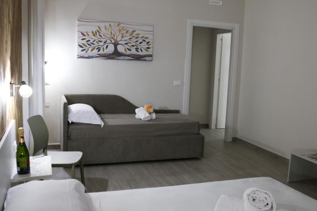 Postel nebo postele na pokoji v ubytování Bed and Breakfast 3 Medaglie