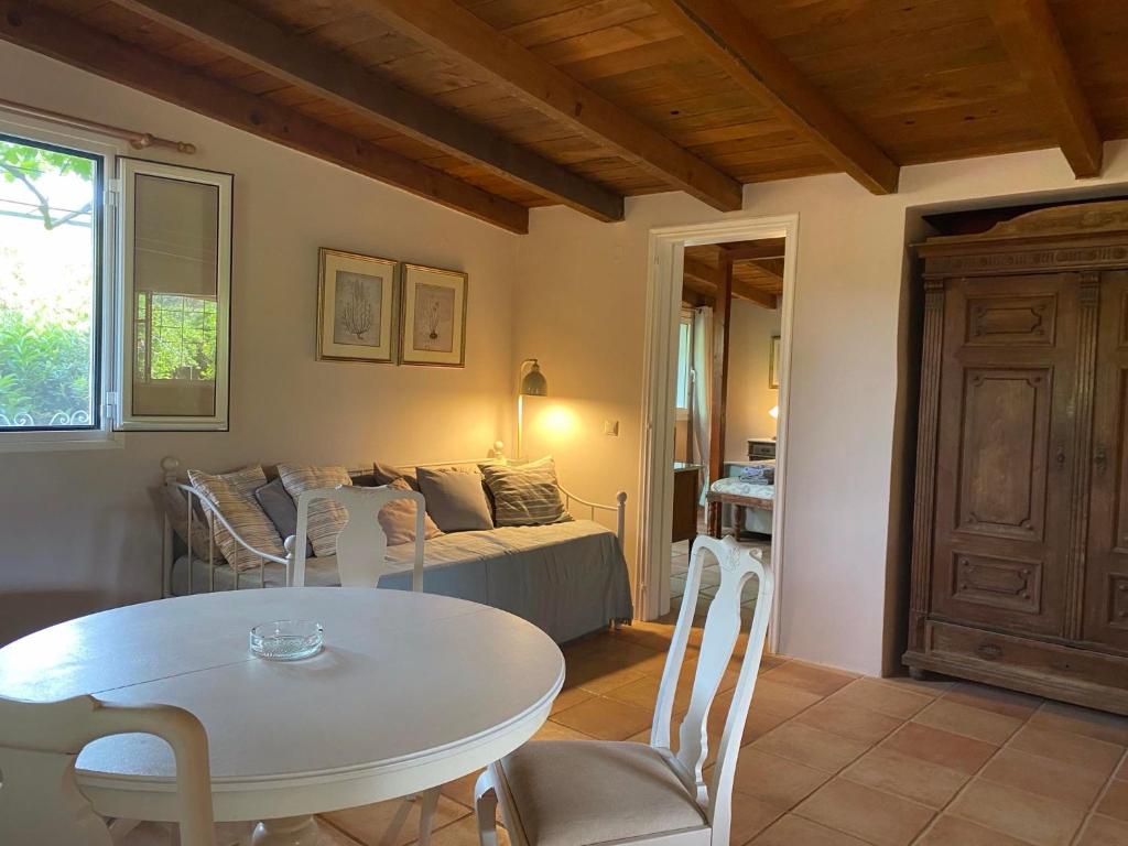 a living room with a table and a couch at Gentilini Retreat in Argostoli