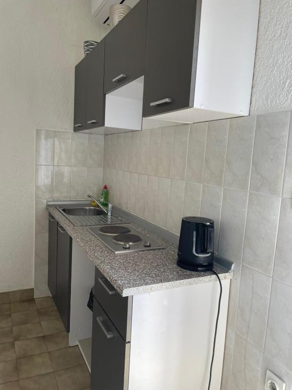 Kuchyň nebo kuchyňský kout v ubytování Apartman More