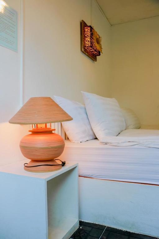 Postel nebo postele na pokoji v ubytování The Light House Resort - Kohlarn เดอะไลท์เฮ้าส์รีสอร์ท เกาะล้าน