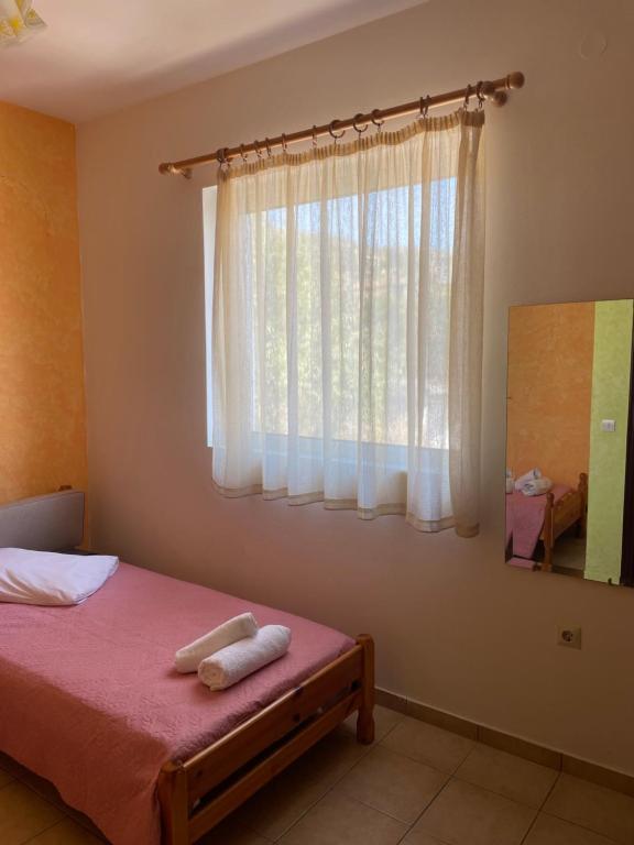 Postel nebo postele na pokoji v ubytování Tasos Manaritsas Rooms