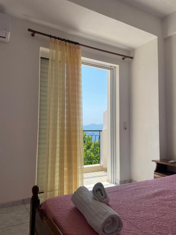 Postel nebo postele na pokoji v ubytování Tasos Manaritsas Rooms