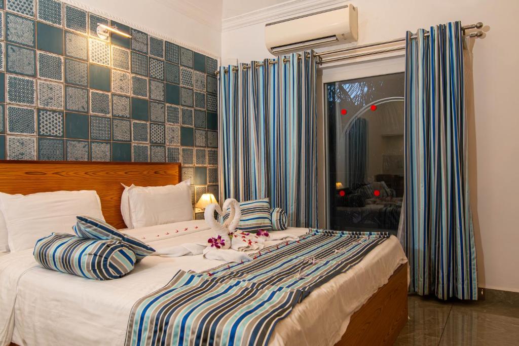 Postel nebo postele na pokoji v ubytování Santana Beach Resort