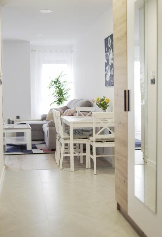 a living room with a white table and a couch at Apartman Marijana in Bjelovar