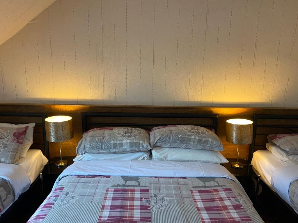 Postel nebo postele na pokoji v ubytování Cameron Guest House