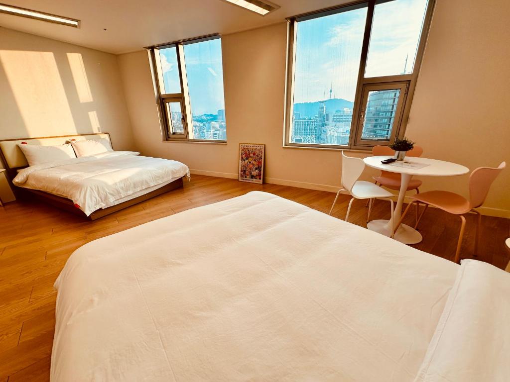 "GRAND OPENED" Maxtyle Guesthouse Dongdaemunにあるベッド