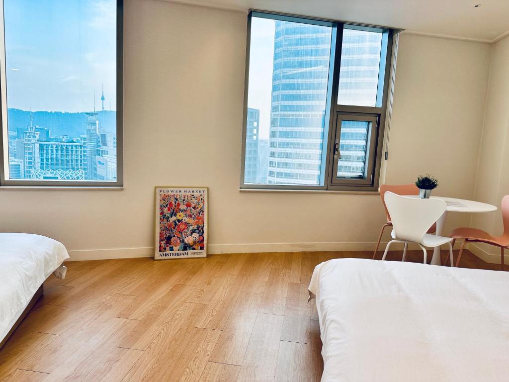"GRAND OPENED" Maxtyle Guesthouse Dongdaemunにあるベッド