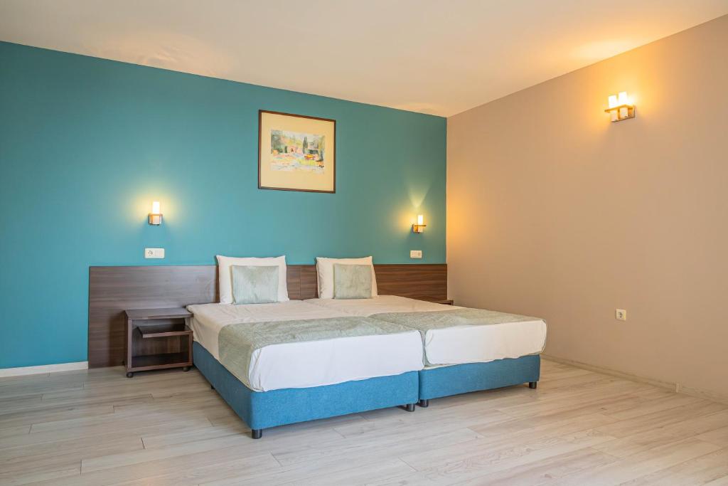 Postel nebo postele na pokoji v ubytování Valeo Hotel