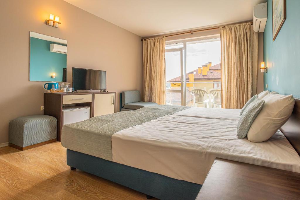 Postel nebo postele na pokoji v ubytování Valeo Hotel